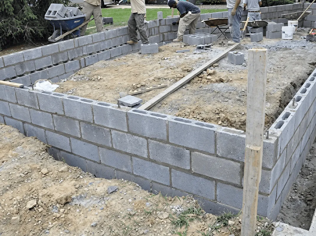 Professionals building a foundation with blocks in Indianapolis, IN