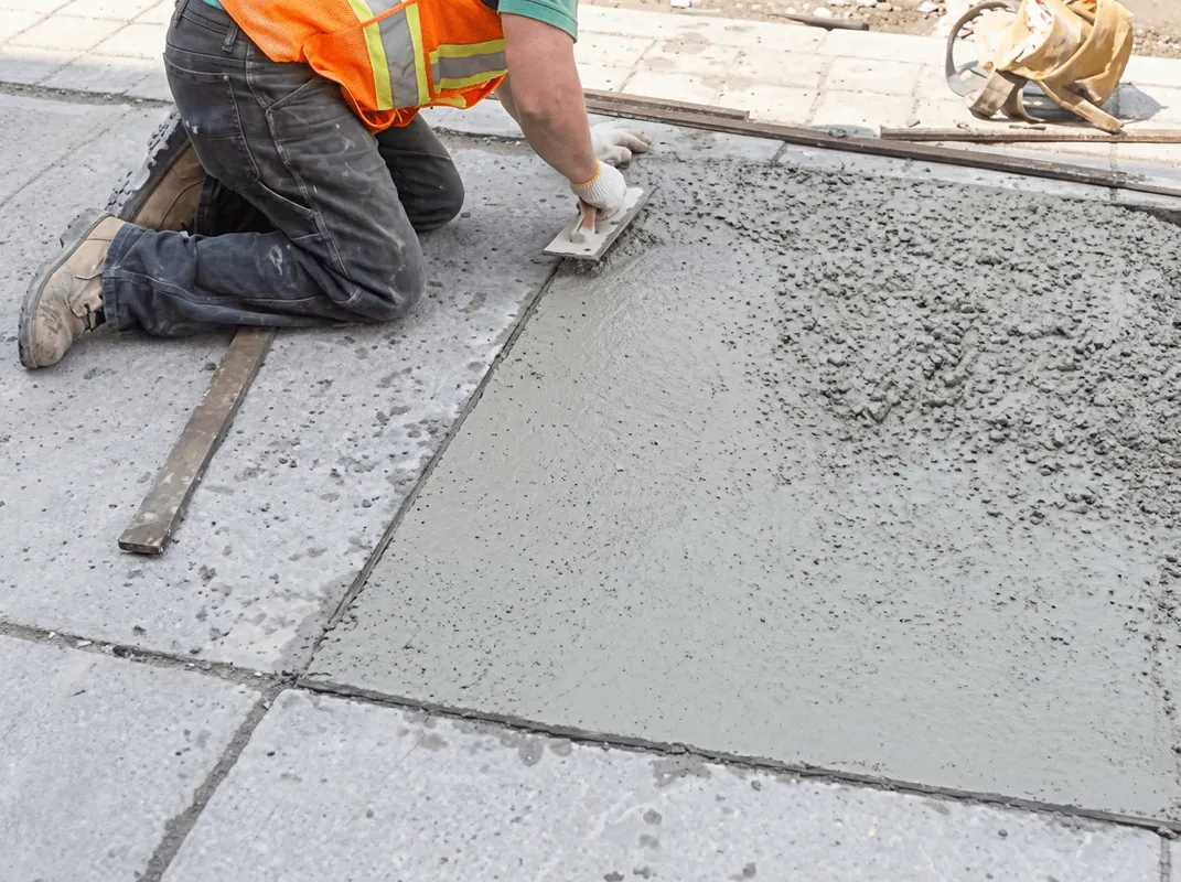 Professional repairing a concrete floor in Indianapolis, IN
